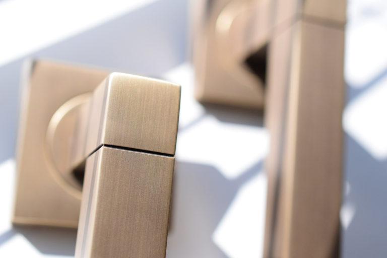 Living vs lacquered solid brass Turnstyle Designs